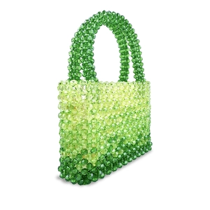 Macro shot of gradient green handmade beaded bag featuring translucent acrylic texture