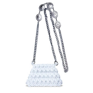 Detail view of mini handmade beaded bag with silver metal chain and engraved ornaments