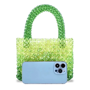 Detail of gradient green handmade beaded handbag with high-gloss transparent acrylic beads
