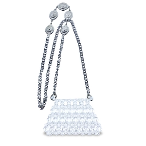 Detail of beaded mini bag with silver chain strap and embossed sun pattern charms
