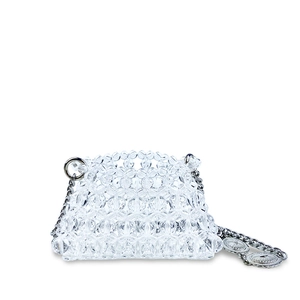 Detail of handmade clear beaded mini bag featuring silver metal chain and vintage charms