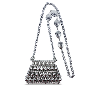 Detail of silver beaded mini bag featuring intricate hollow weave and chain with metal charms