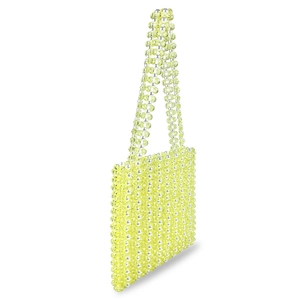 Détail de perles en acrylique jaune et perles sur un sac à bandoulière tissé main