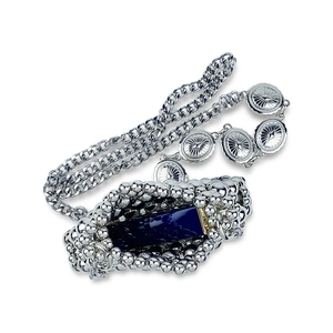 Detail of silver mini bag with blue gemstone and pearl chain strap in sunburst motif