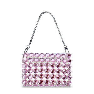 Close-up of pink crystal beaded handbag with silver metal chain and white lining