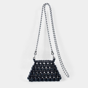 Detailed view of handmade black beaded mini bag with elegant silver ball chain strap