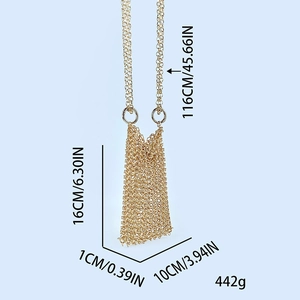 Detail view of woven gold chainmail mini bag showing dimensions and metallic texture