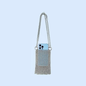 Detail of silver chainmail phone bag showing hand-woven metal mesh and slim chain strap