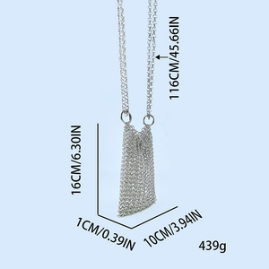Detailed view of silver chainmail mini bag showing dimensions and handwoven metal texture