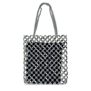 Close-up of handmade silver beaded tote bag with a diamond grid weave and black lining