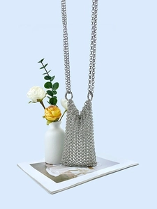 Handcrafted silver chainmail crossbody mini bag with metal mesh texture and long chain strap