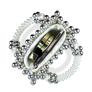 Detail of beaded evening bag with white pearls, silver beads and interior storage capacity