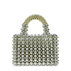 Close-up of hand-beaded mesh texture on a silver and gold evening clutch bag