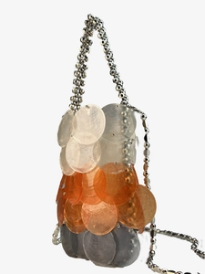 Detailed view of large layered sequins and multifaceted silver beaded chain strap