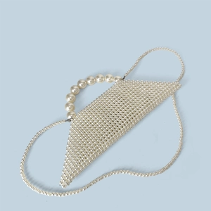 Detailed view of handcrafted white pearl beaded handbag with unique geometric weave texture
