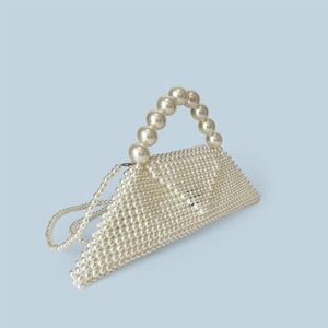 Detail of handmade pearl bead handbag showing unique triangular structure and texture