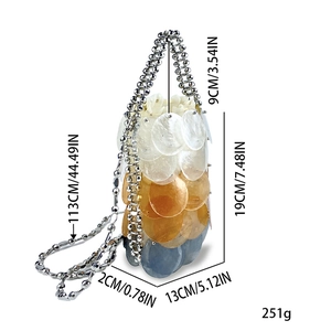 Detailed view of gradient sequin bucket bag with silver bead handle and metal ball chain