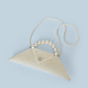 Detail of handmade triangular pearl handbag with smooth beaded surface and long chain