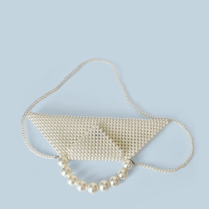 Detail of triangular pearl beaded handbag with large round pearl top handle and strap