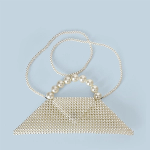 Close-up of handmade triangular pearl bead handbag with large pearl handle and strap