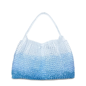 Detailed view of handmade gradient blue beaded handbag with translucent crystal texture