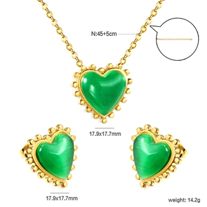 Detail of vintage cat eye heart jewelry set with beaded gold edges and dimensions
