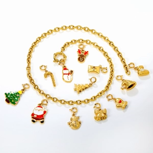 Golden Christmas jewelry set with snowman and reindeer charms on stainless steel chains
