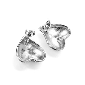Detailed back view of silver heart stud earrings showing butterfly backs and smooth metal finish
