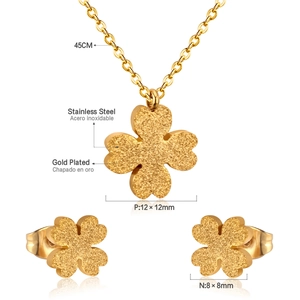 Detail of frosted gold clover necklace and earrings set with exact size measurements