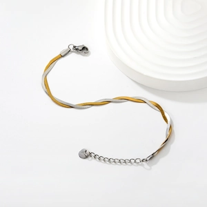 Two-tone intertwined snake chain bracelet in 18k gold and silver stainless steel finish