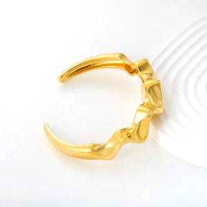 Irregular wavy 18K gold plated stainless steel open bangle with a polished mirror finish