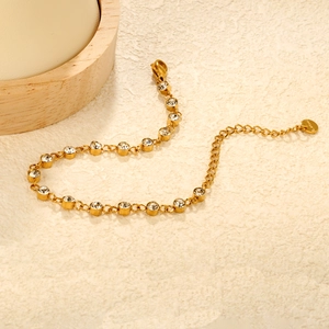 Elegant gold stainless steel bracelet with sparkling round white crystals and lobster clasp