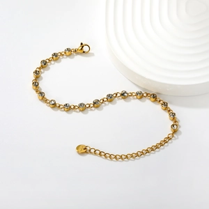 Elegant gold-plated stainless steel bracelet with sparkling white crystals and lobster clasp