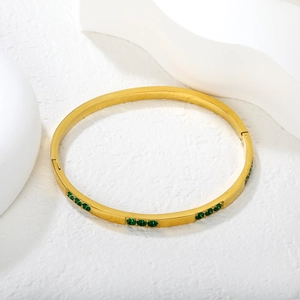Minimalist double-layered stainless steel bangle with emerald green zircon inlays