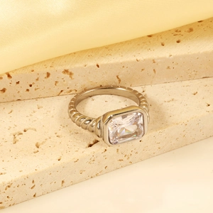 Macro view of vintage silver ring with rectangular crystal and twisted rope band details