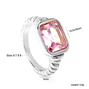 Detailed view of pink rectangular zircon ring with spiral texture band and 18K gold plating
