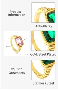 Macro view of rectangular green emerald on gold plated twisted stainless steel band