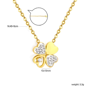 Gold stainless steel four-leaf clover pendant necklace with crystals on white background
