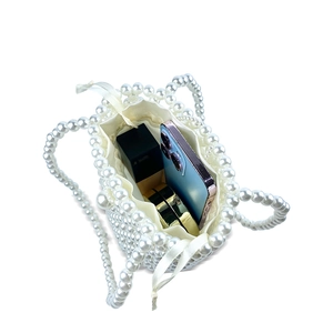 Top view of pearl bucket bag showing internal capacity with drawstring liner inside