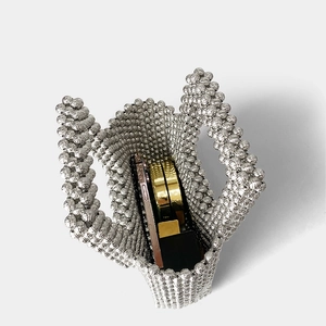 Detailed interior view showing storage capacity of the silver beaded acrylic handbag