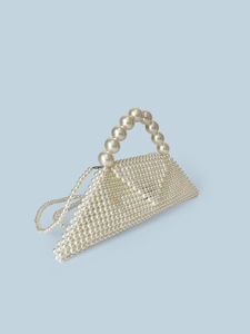 Artistic triangle handmade pearl beaded handbag with strap on light blue background