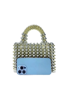 Handmade woven metal bead handbag in gold and silver tones with smartphone for size comparison