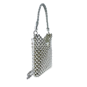 Detail of silver metallic beaded mini bag with woven handle and chain shoulder strap