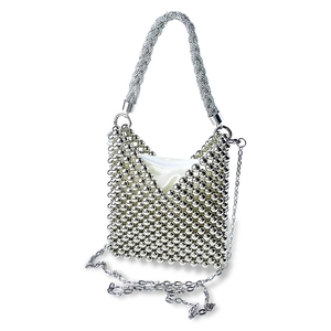 Detailed close-up of silver beaded handbag with V-shaped opening and elegant chain strap