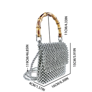 Detailed view of silver beaded handbag with bamboo handle and size measurement labels