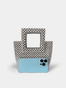 Silver beaded square handbag with woven acrylic pearls and phone for scale reference
