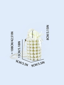 Elegant white pearl beaded bucket bag with gold accents and silk drawstring liner