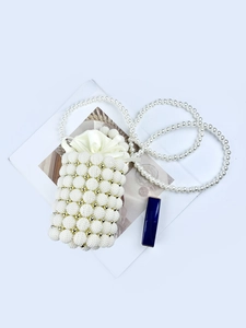 Elegant white pearl beaded crossbody bag with drawstring lining and long chain strap
