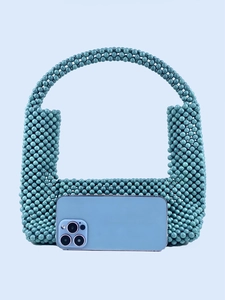 Handmade turquoise beaded handbag with U-shaped handle and marble texture finish