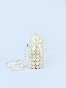 Detailed view of white pearl beaded bucket bag with elegant satin drawstring lining